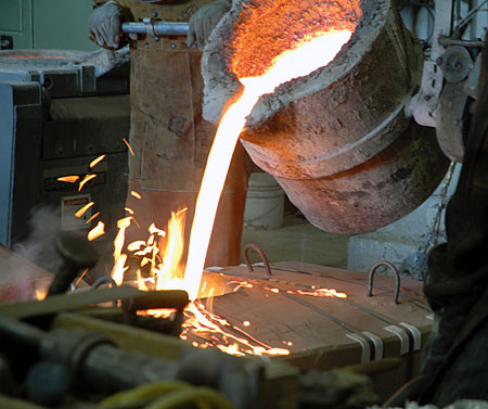 Molten bronze is poured at Laran Bronze in Chester for the first stages of casting of 'Keys To Community,' a bronze sculpture of Ben Franklin for downtown Philadelphia