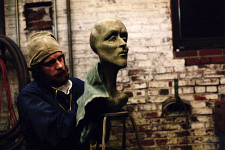 James Peniston works a plaster sculpture in his West Philadelphia studio